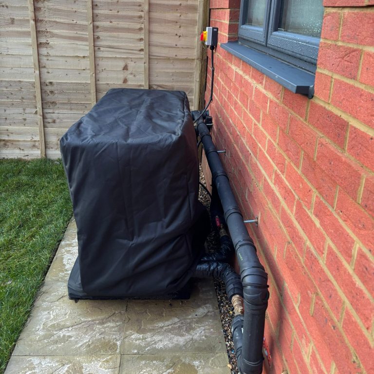Close-up of a partially unzipped black fabric bag on a light surface.