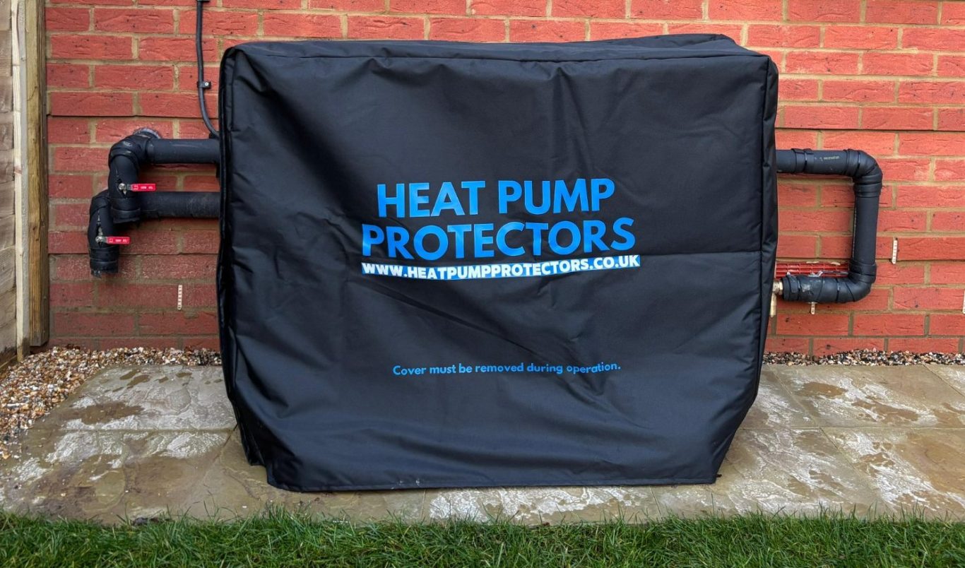 Black cover for a heat pump, featuring the text "HEAT PUMP PROTECTORS" in blue.